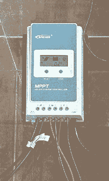 a blue box with a small screen indicating battery level and solar panel charge